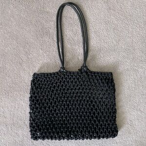 Clare V. Sandy in Black